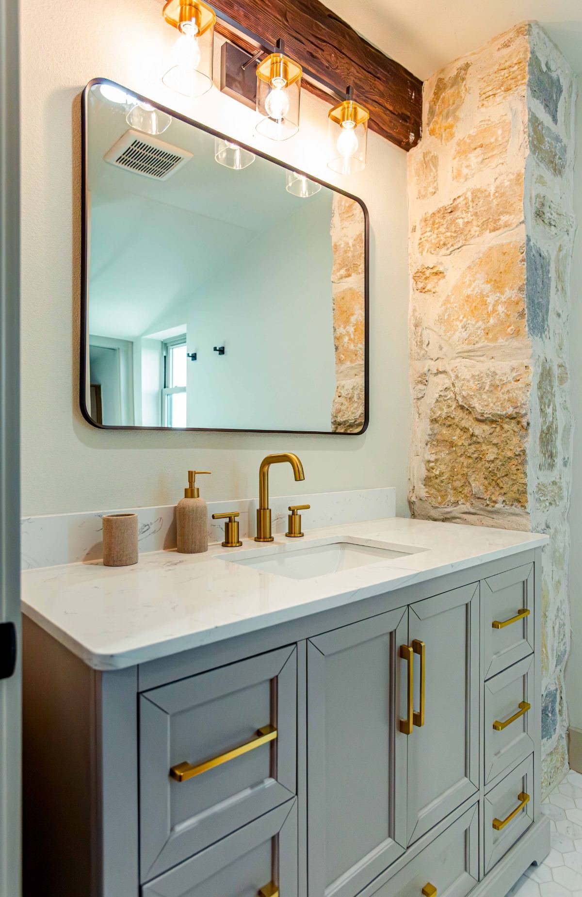 Vanity with brass fixtures