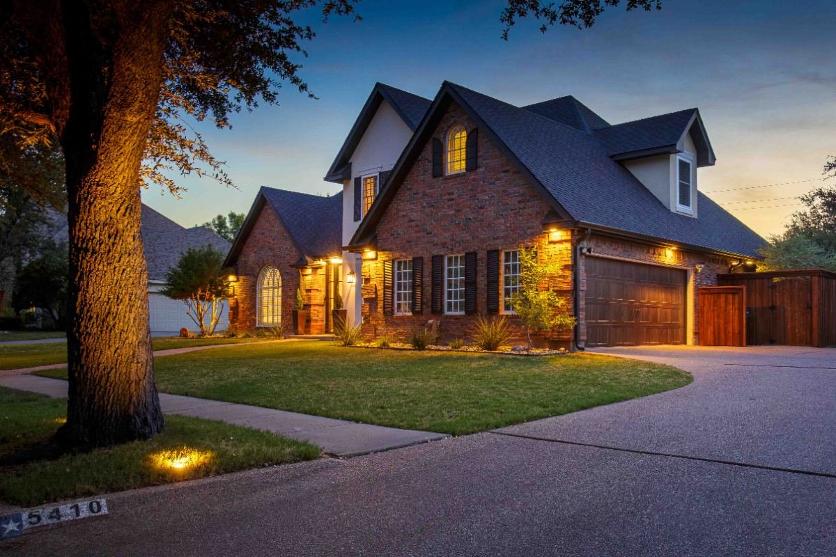 Dusk exterior with warm-lit windows